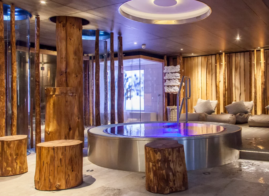 Champneys Forest Mere thermal suite with hydrotherapy pool, timber columns and spa relaxation area