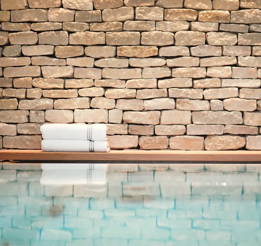 Natural stone wall detail at Homefield Grange spa with hydrotherapy pool and calm wellness retreat setting