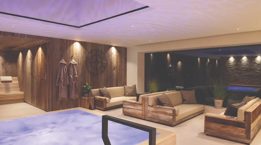 Hydrotherapy pool with infinity edge and magnetic relaxation loungers at Homefield Grange thermal spa