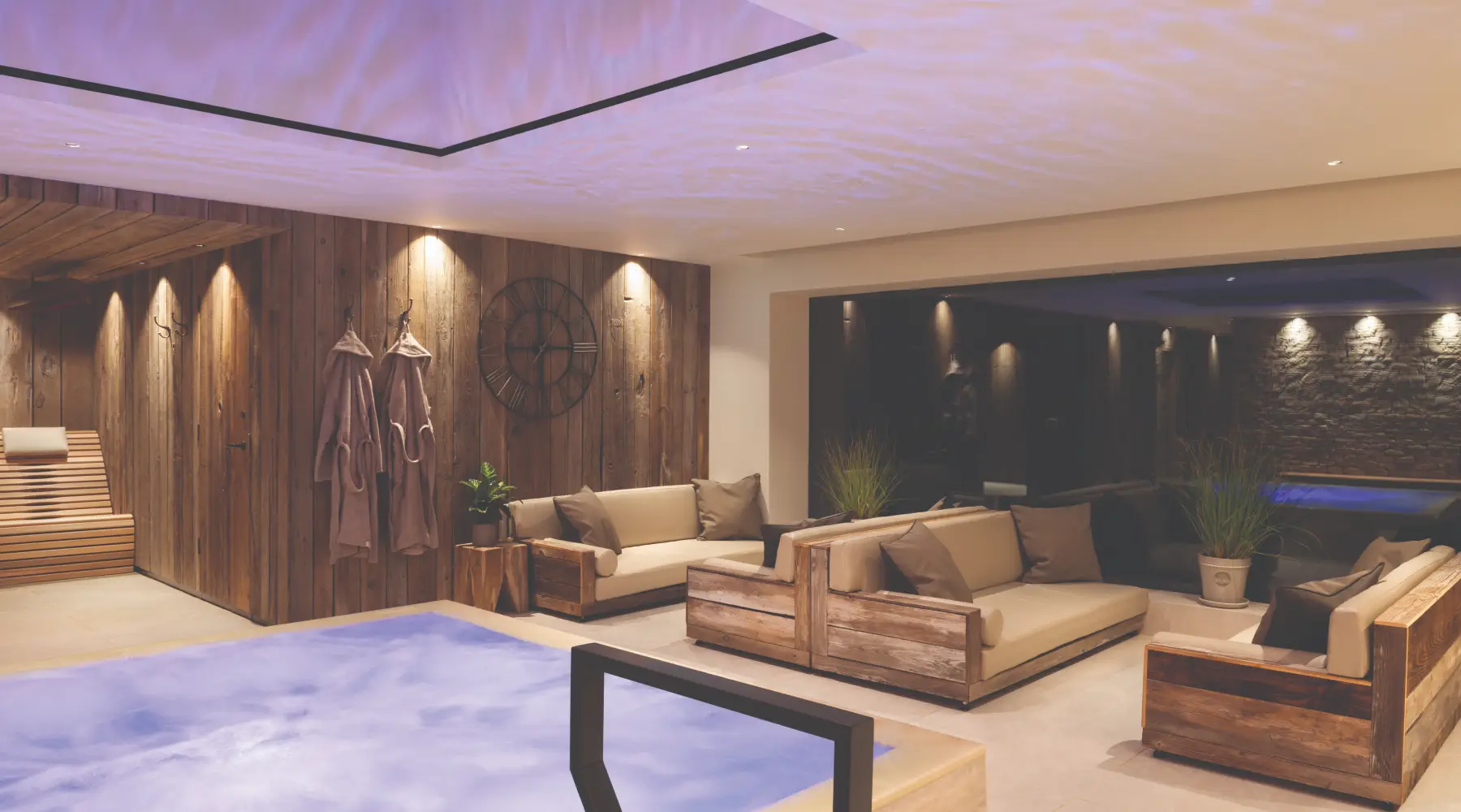 Hydrotherapy pool with infinity edge and magnetic relaxation loungers at Homefield Grange thermal spa
